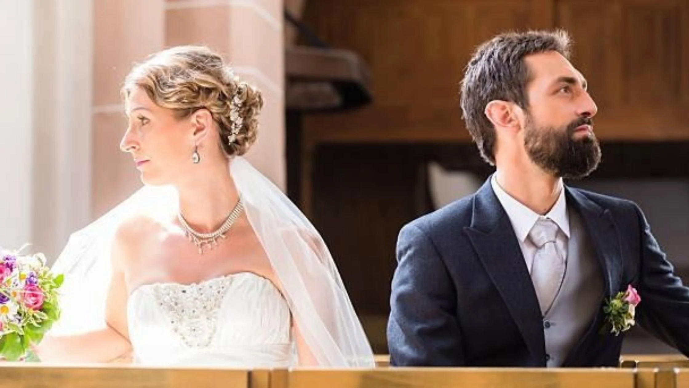 bride and groom facing away from each other