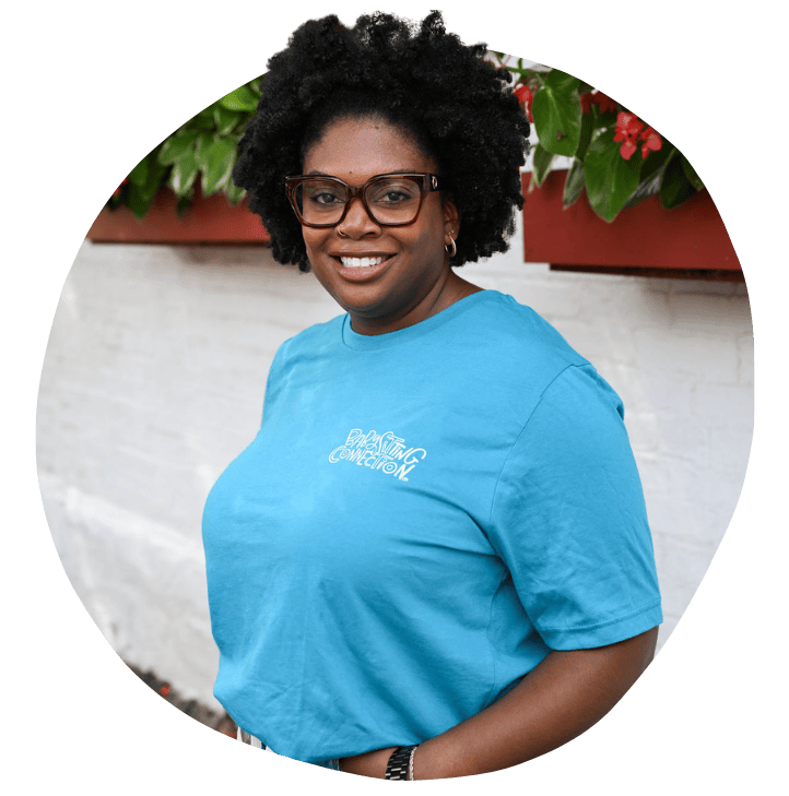 Headshot of Marcia in Blue Babysitting Connection shirt