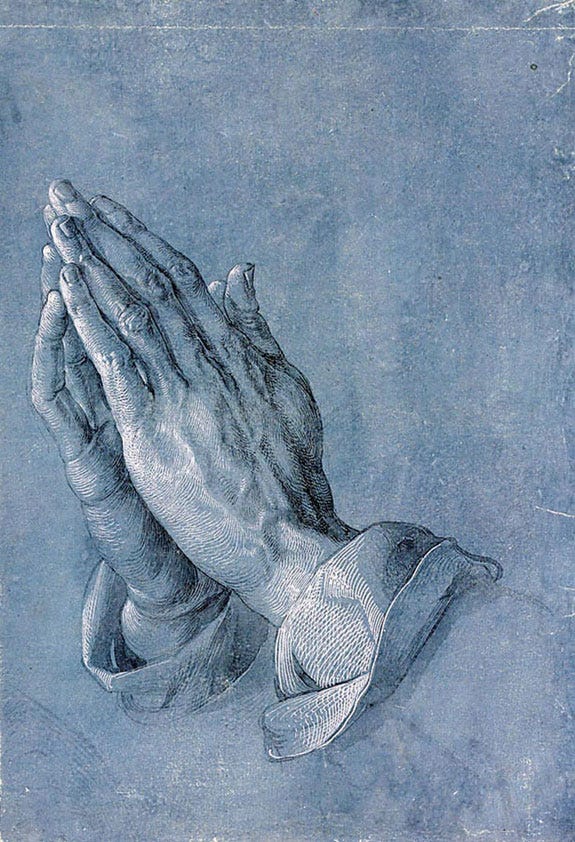 Albrecht Dürer’s drawing of two hands pressed together in prayer against a blue-gray background. Albrecht Dürer’s drawing of two hands pressed together in prayer against a blue-gray background.
