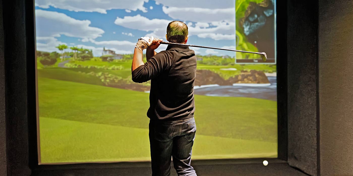 Man playing Golf Simulator