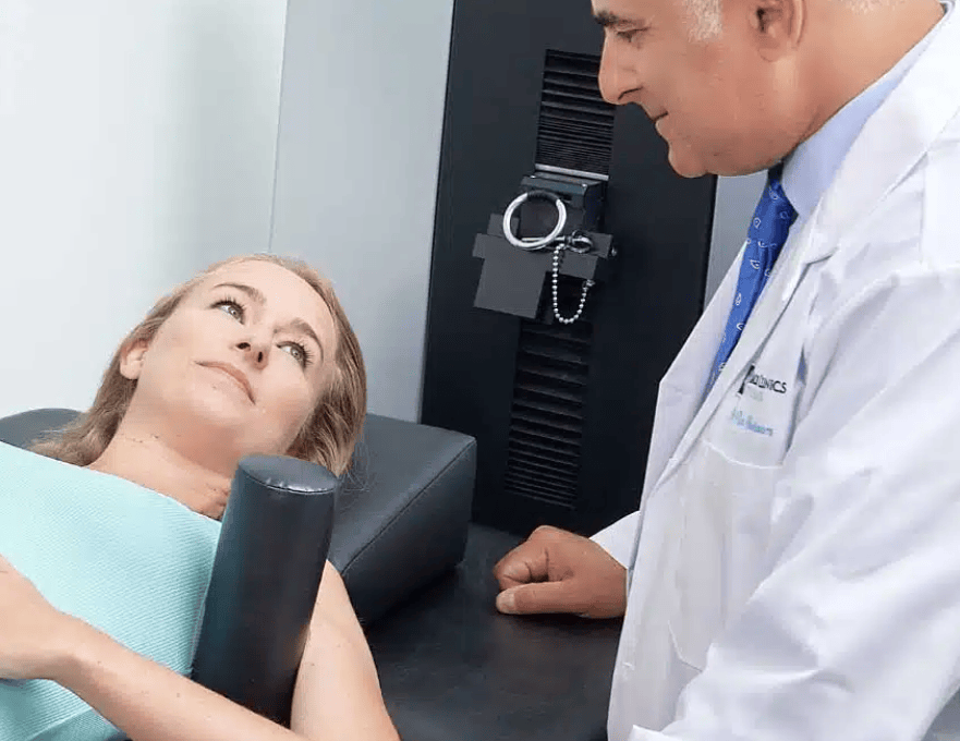 Dr. Ron Nusbaum treating a patient with non-surgical spinal decompression