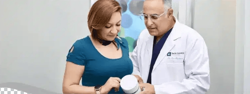 Dr. Ron Nusbaum reviewing Disc Renewal Plus with a patient