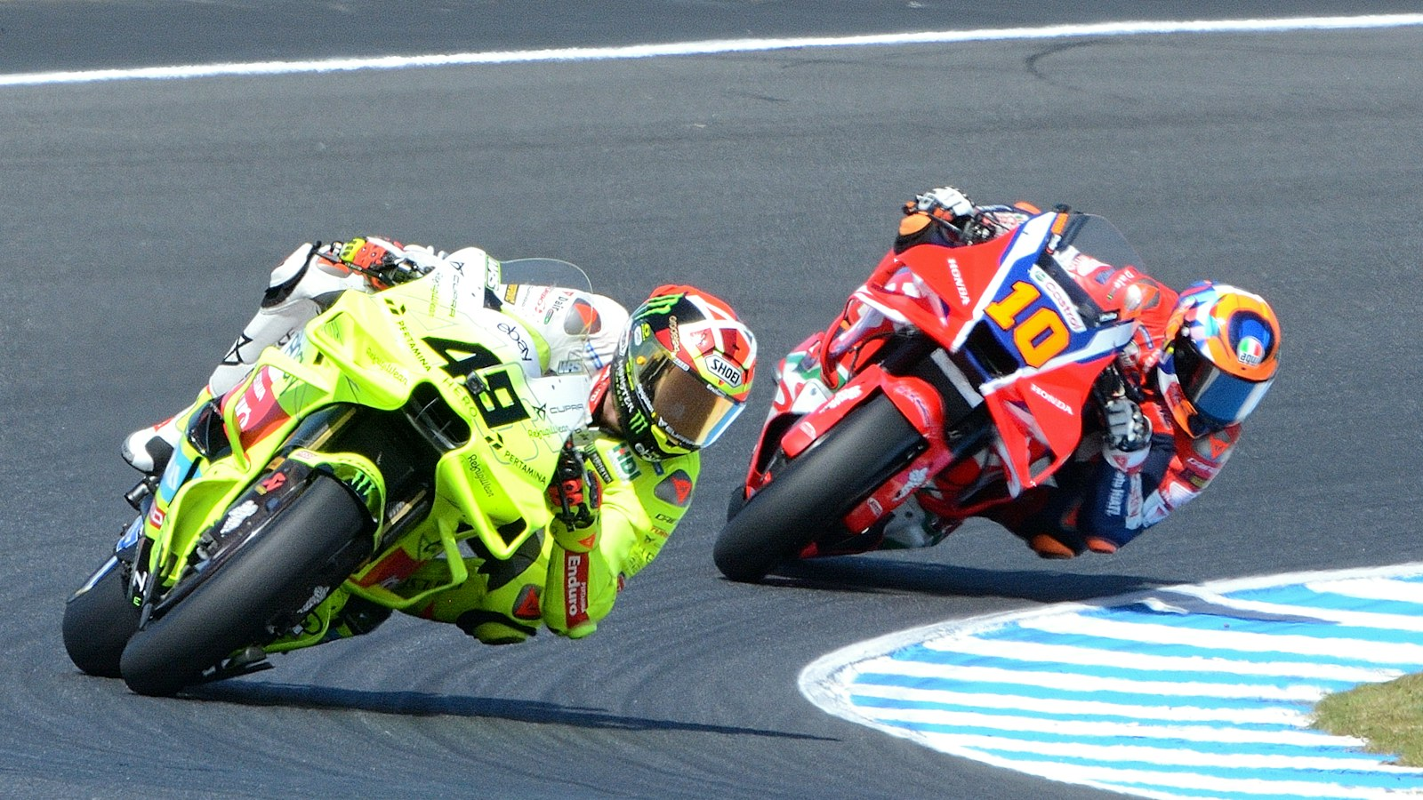 Two MotoGP riders lean through a corner at Phillip Island, the circuit that hosted the 2013 Australian MotoGP