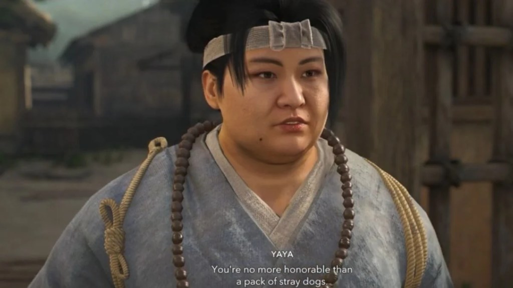 Yaya looking skeptical during a conversation about honor and stray dogs in Assassin's Creed Shadows.