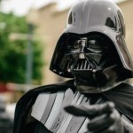 Man in Darth Vader costume gesturing at San Diego City Council podium during public comment on Flock cameras