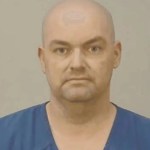 Mugshot photo of Benjamin C. Larson, a 47-year-old Wisconsin man accused of felony stalking and possession of stolen human remains.