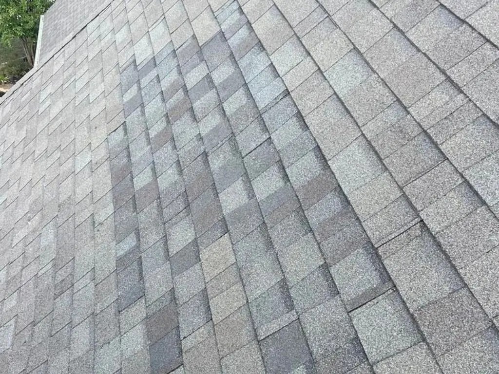 Shingle roof after a wind damage roof repair was completed