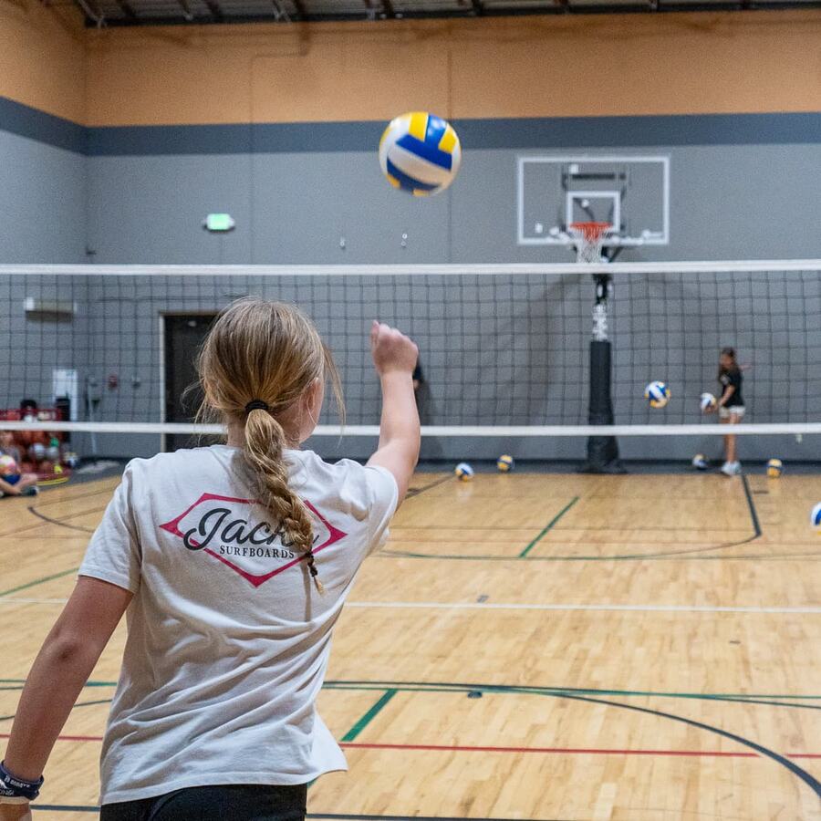 Volleyball player serving at Bailey's Sports