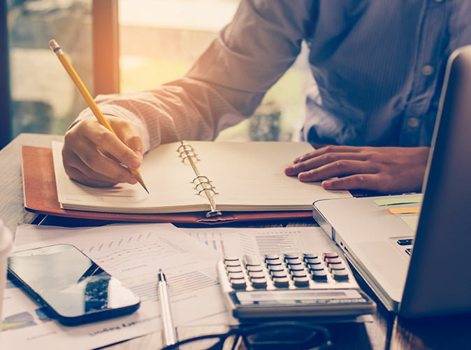Man writing in notebook