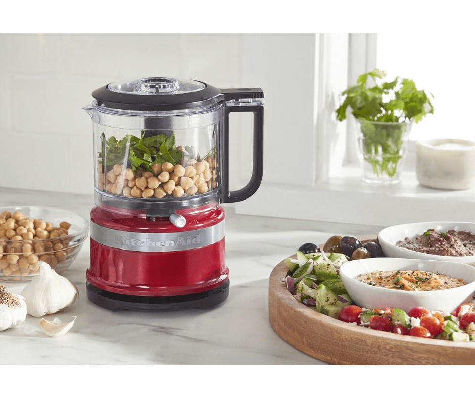 red kitchenaid mini food processor with chickpeas and cilantro