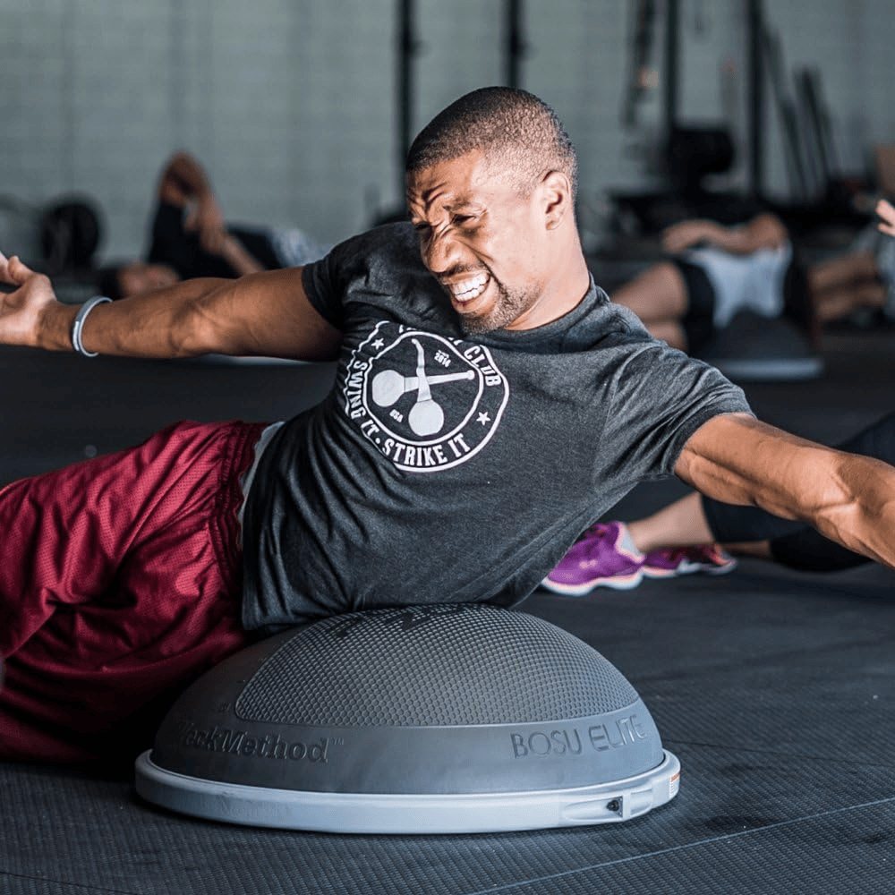 man working out using bosu elite half ball
