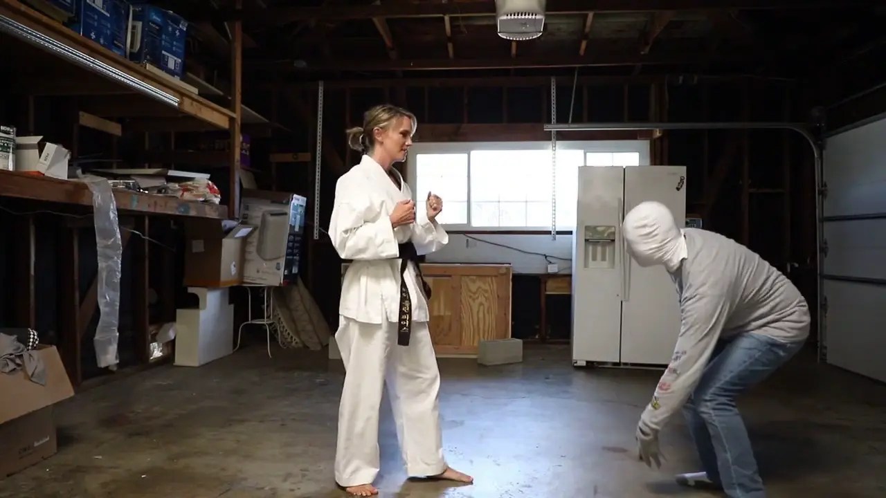 Blackbelt Girl kicking nuts