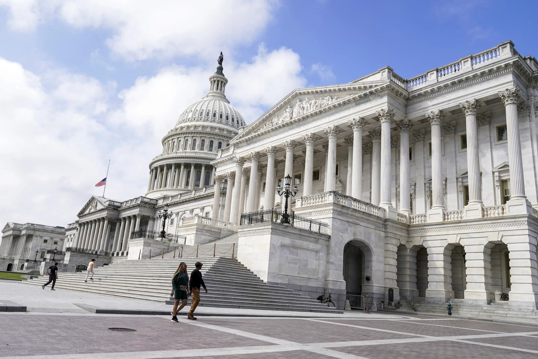 People walk outside the U.S. Capitol on Monday, Sept.11, 2023, in Washington. Photo credit: Mariam Zuhaib / AP.