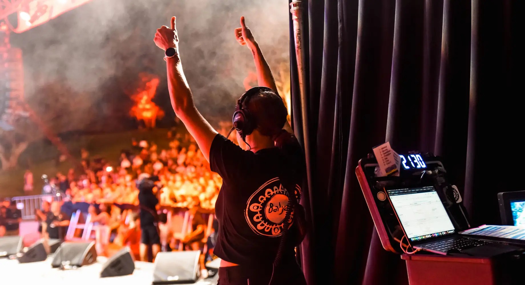 Letisha back stage with raised hands and thumbs up