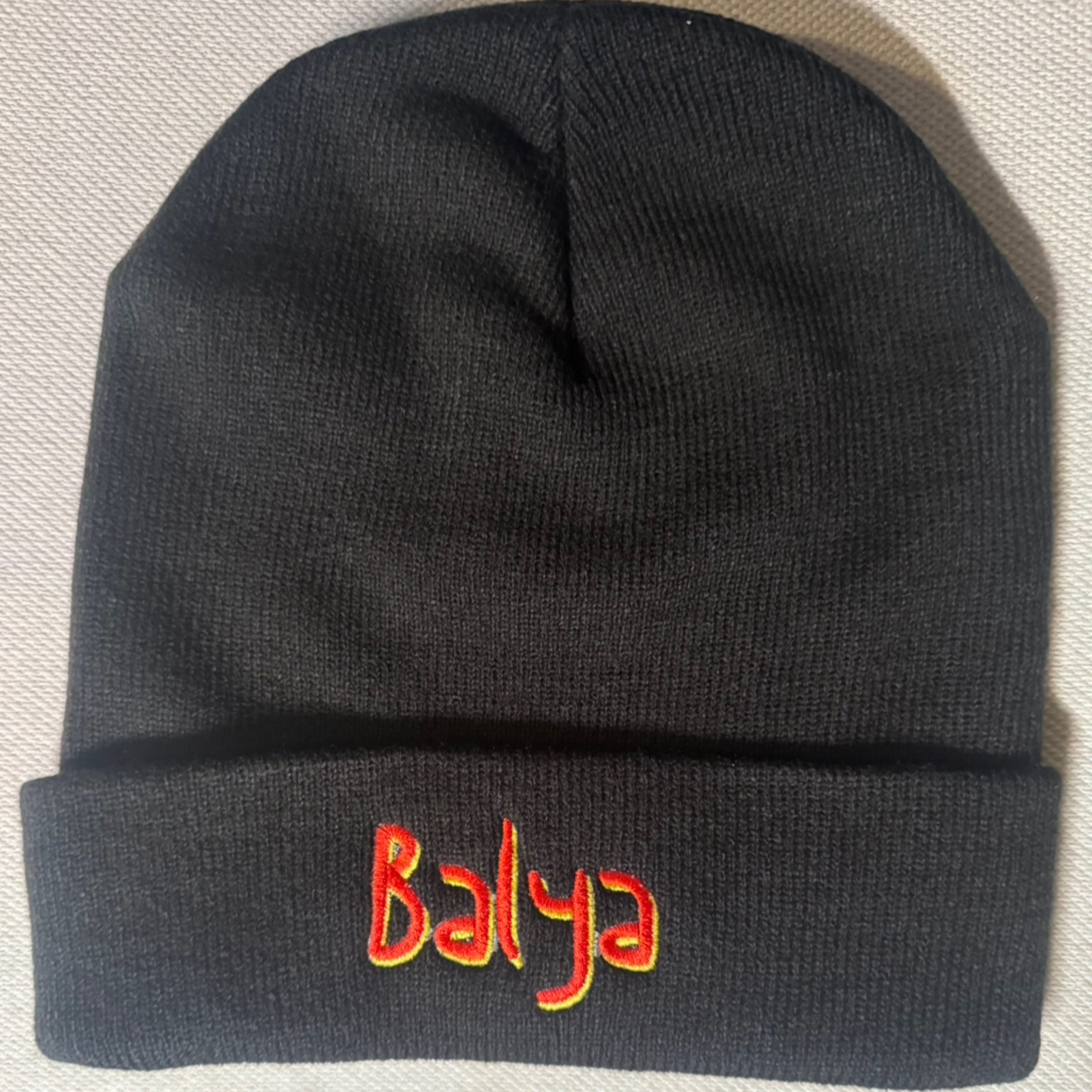 Black beanie with red and yellow embroidered Balya logo