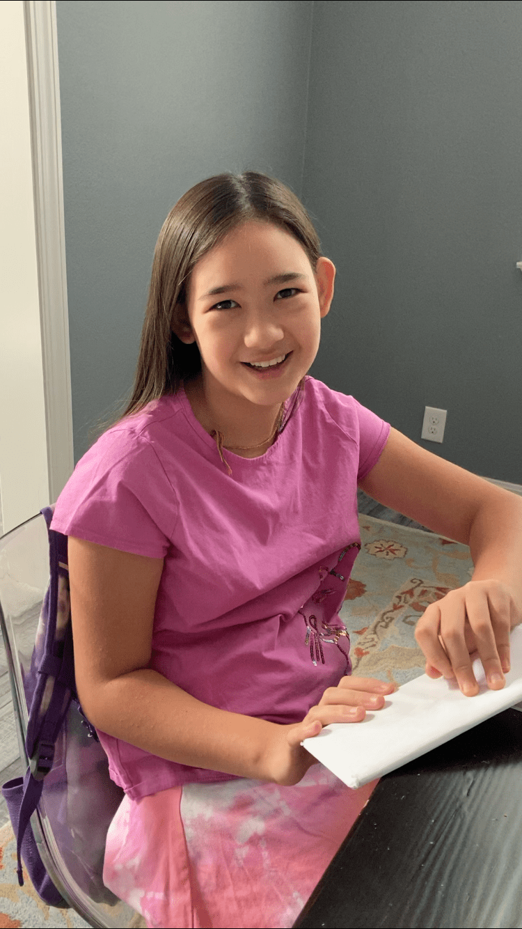 CAMPer opening up their welcoming envelope pre-CAMP 2021!