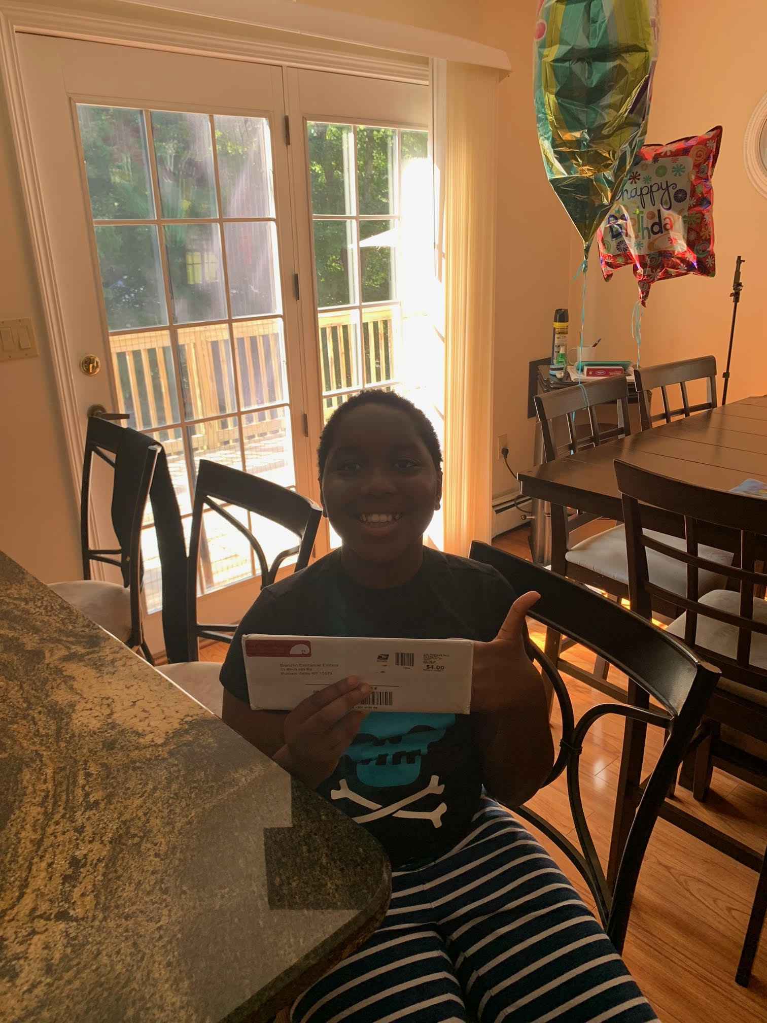 CAMPer opening up their welcoming envelope pre-CAMP 2021!