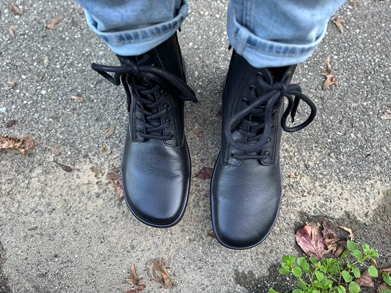 Classic black barefoot boots styled with rolled-up jeans.