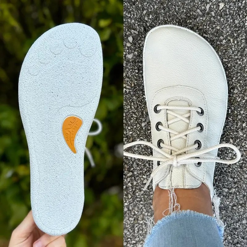Minimalist white barefoot sneaker shown next to its sole.
