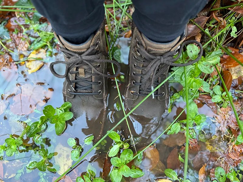 Brown barefoot hiking boots worn outdoors