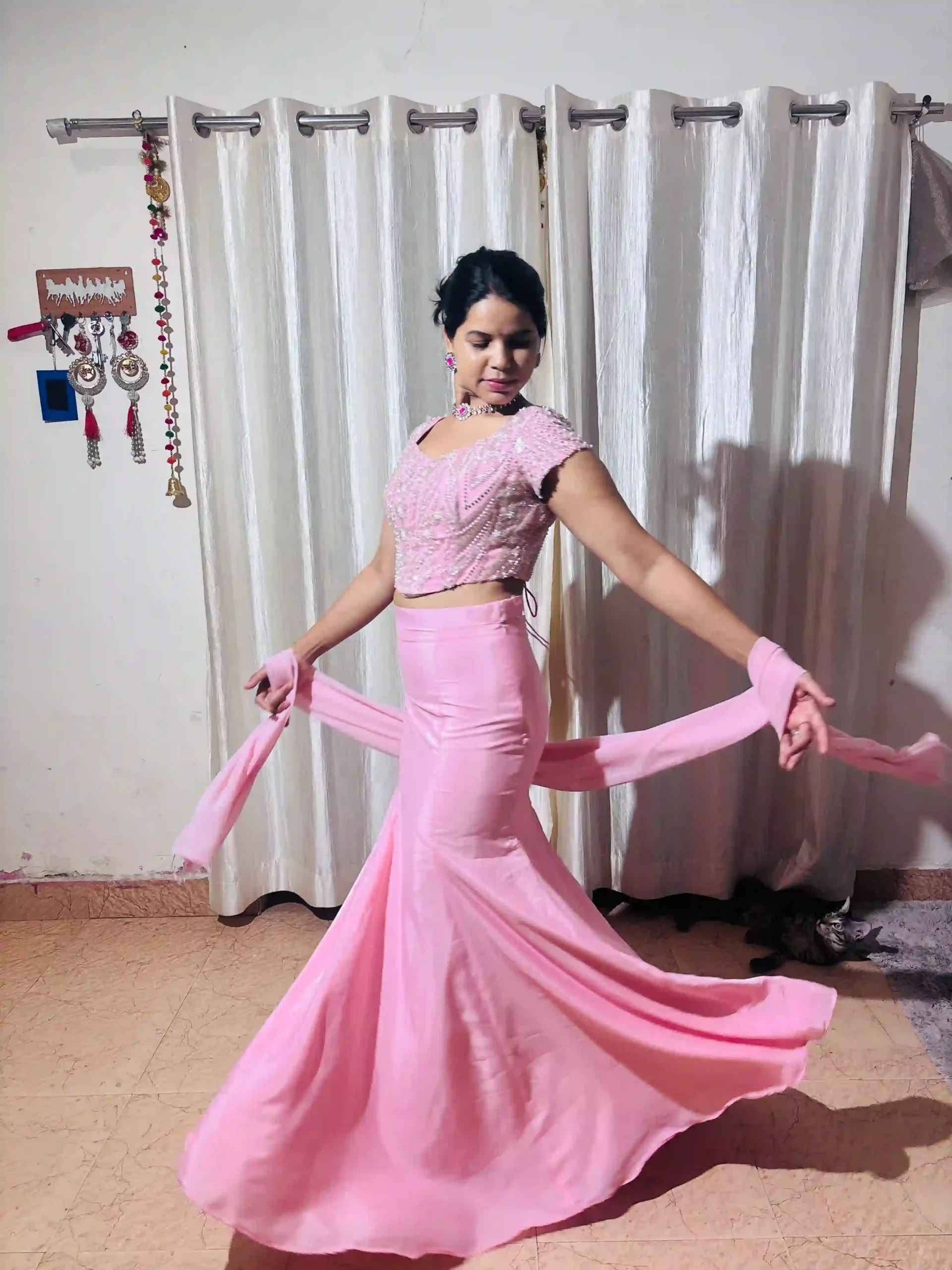 Barhin blush pink corset set dupatta held out in motion