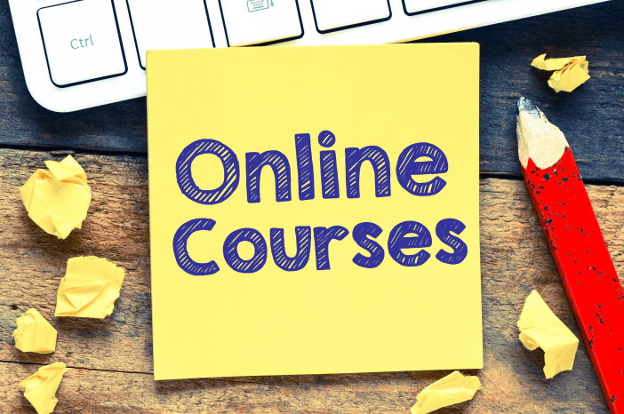 A learner taking notes while studying online