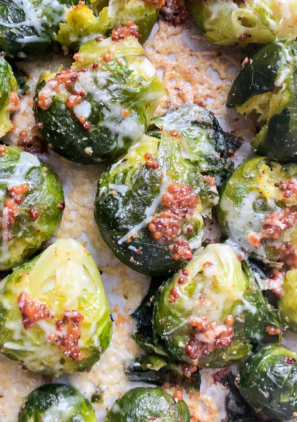 Close-up of smashed
Brussels sprouts with grainy
mustard and parmesan