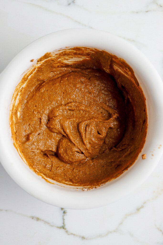 Protein pumpkin bread batter mixed in a white bowl