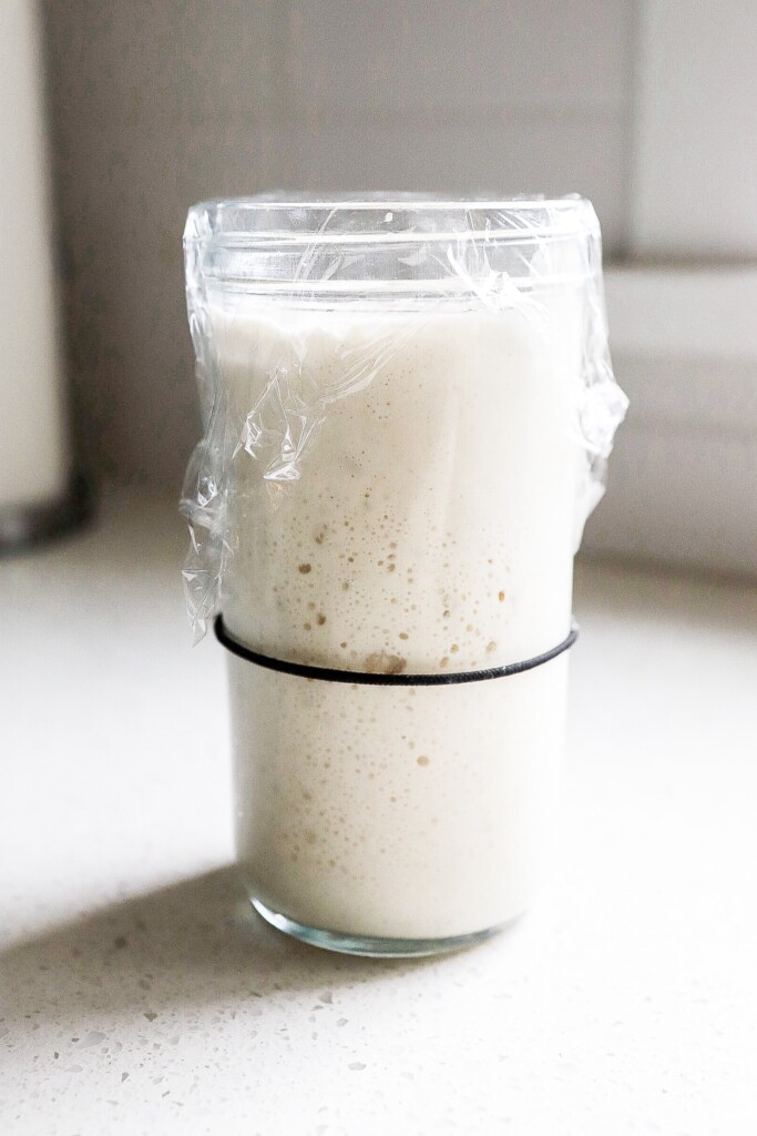 sourdough starter for the pumpkin cinnamon swirl sourdough loaf in a large glass mason jar