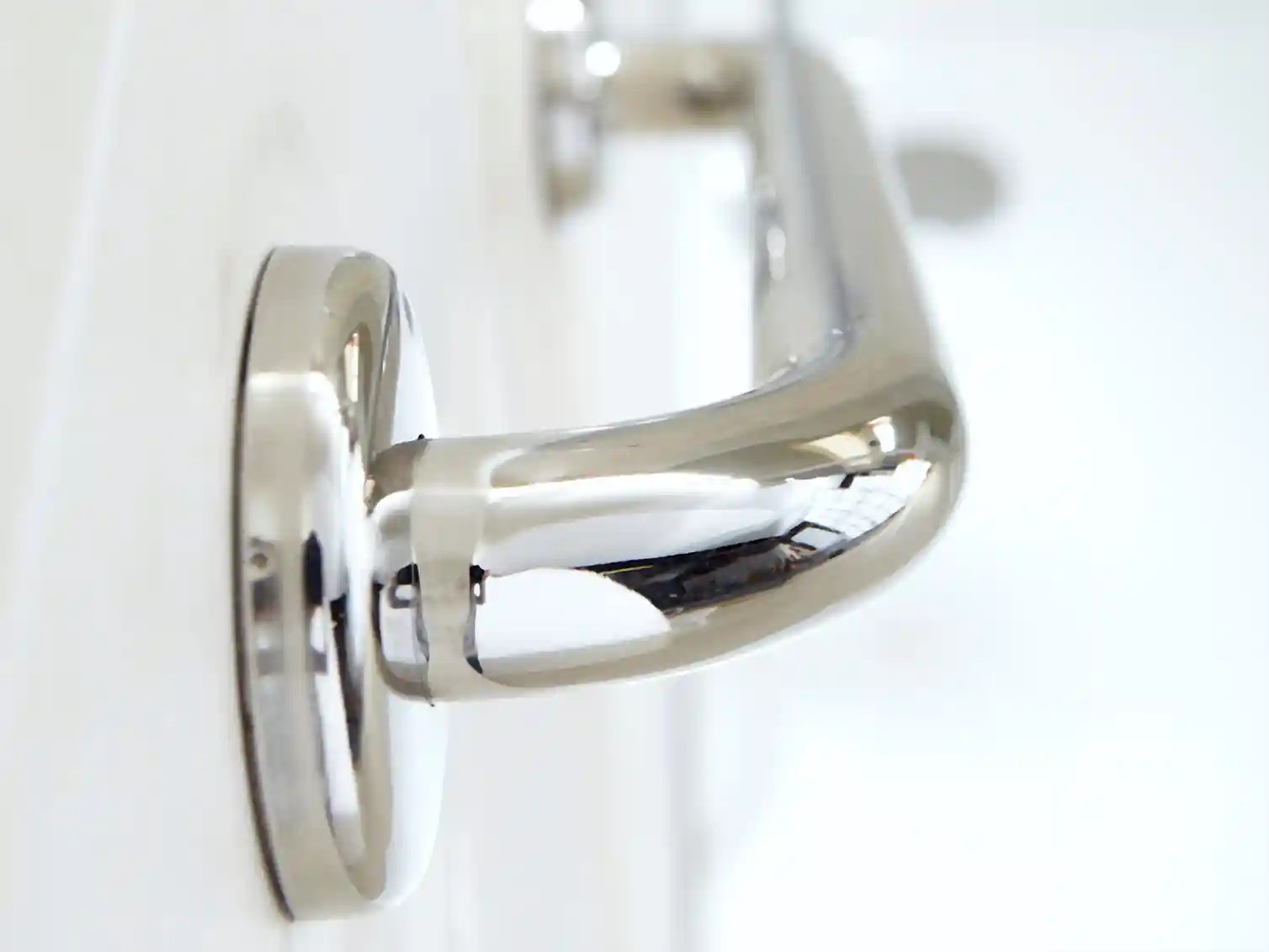 Safety handrail installation in a tub-to-shower conversion, providing added peace of mind for bathroom accessibility