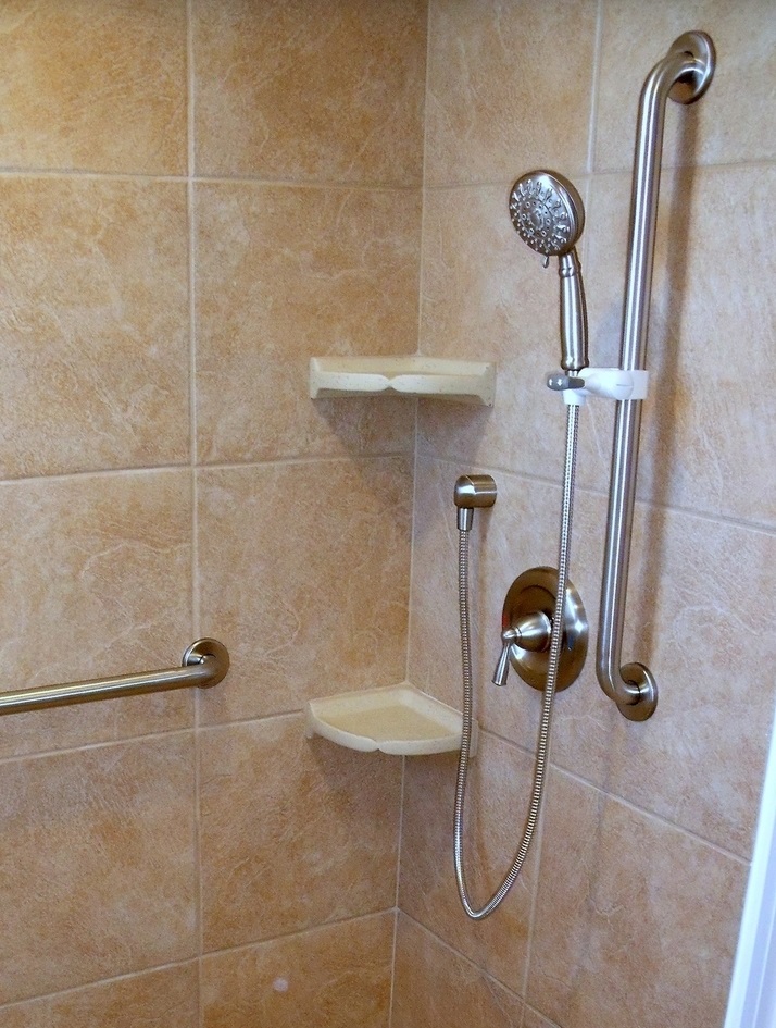 Trenworks grab bar with shower wand holder — professionally installed by Robby