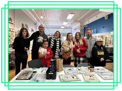 Group of adults and youth post together at an event.