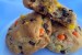 Two Reese's Pieces cookies with half a cookie lying on top.