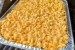 A pan of homemade mac and cheese on the BBQ.