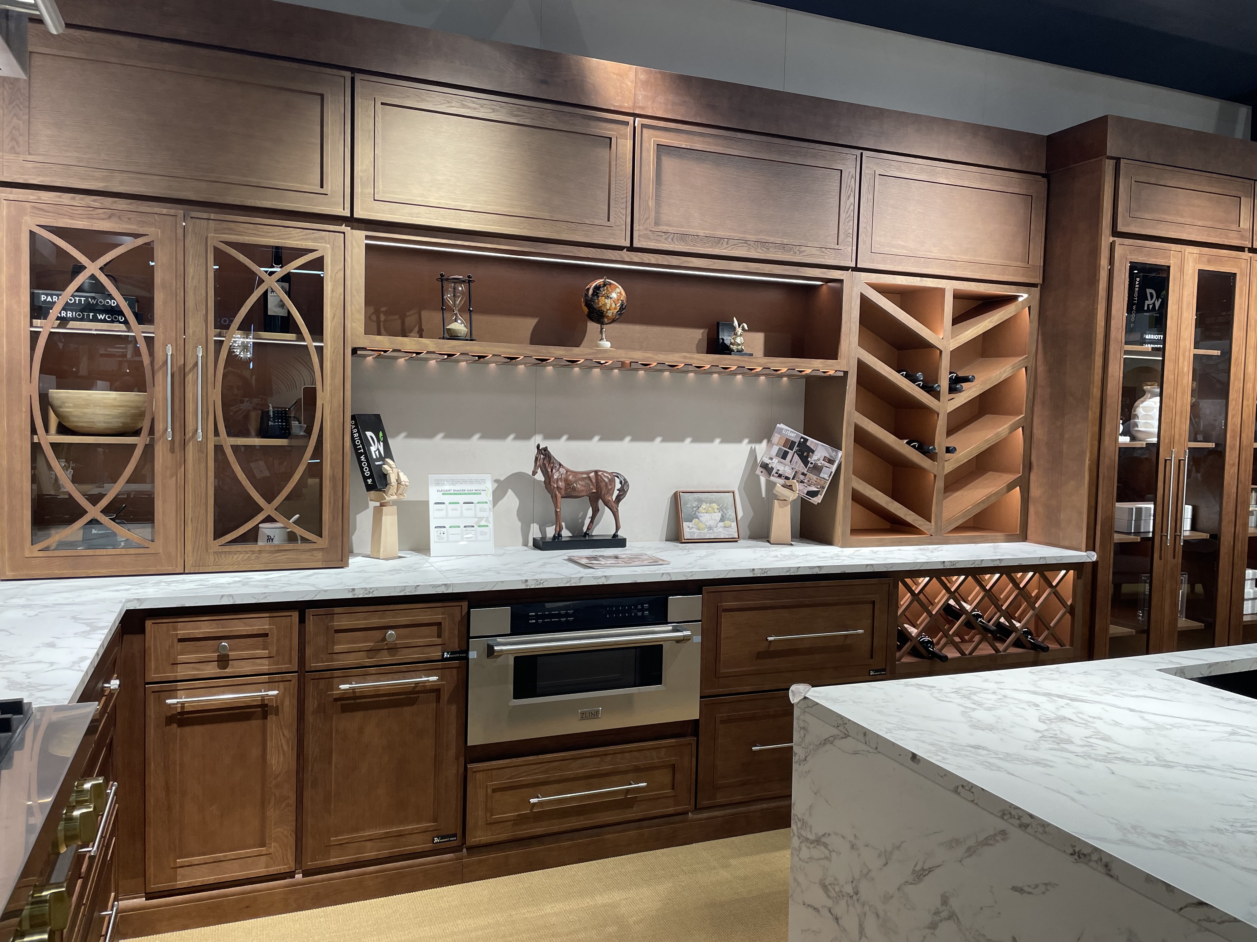 KBIS KITCHEN WITH WOOD ACCENTS AND WINE STORAGE