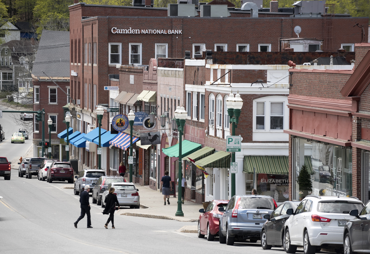 People cross a downtown street.