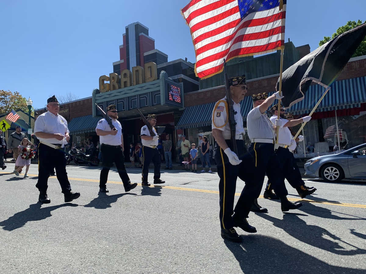 Veterans march down Main Street.