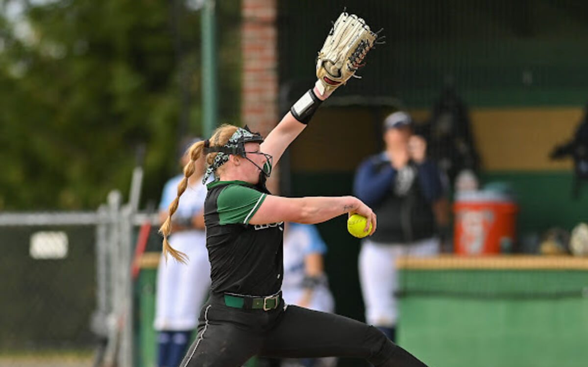 A softball pitcher throws a ball