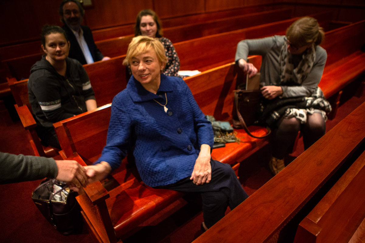 Janet Mills sits in a Portland courtroom as the fate of Medicaid expansion is debated.