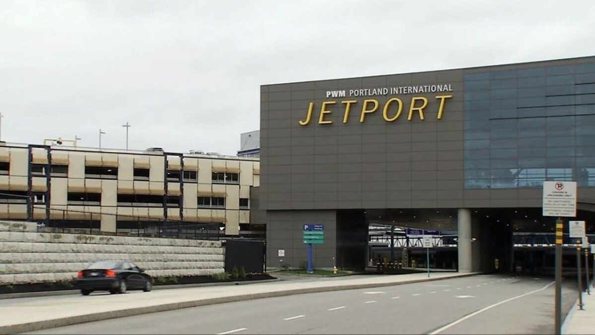 A car drives up to an airport.