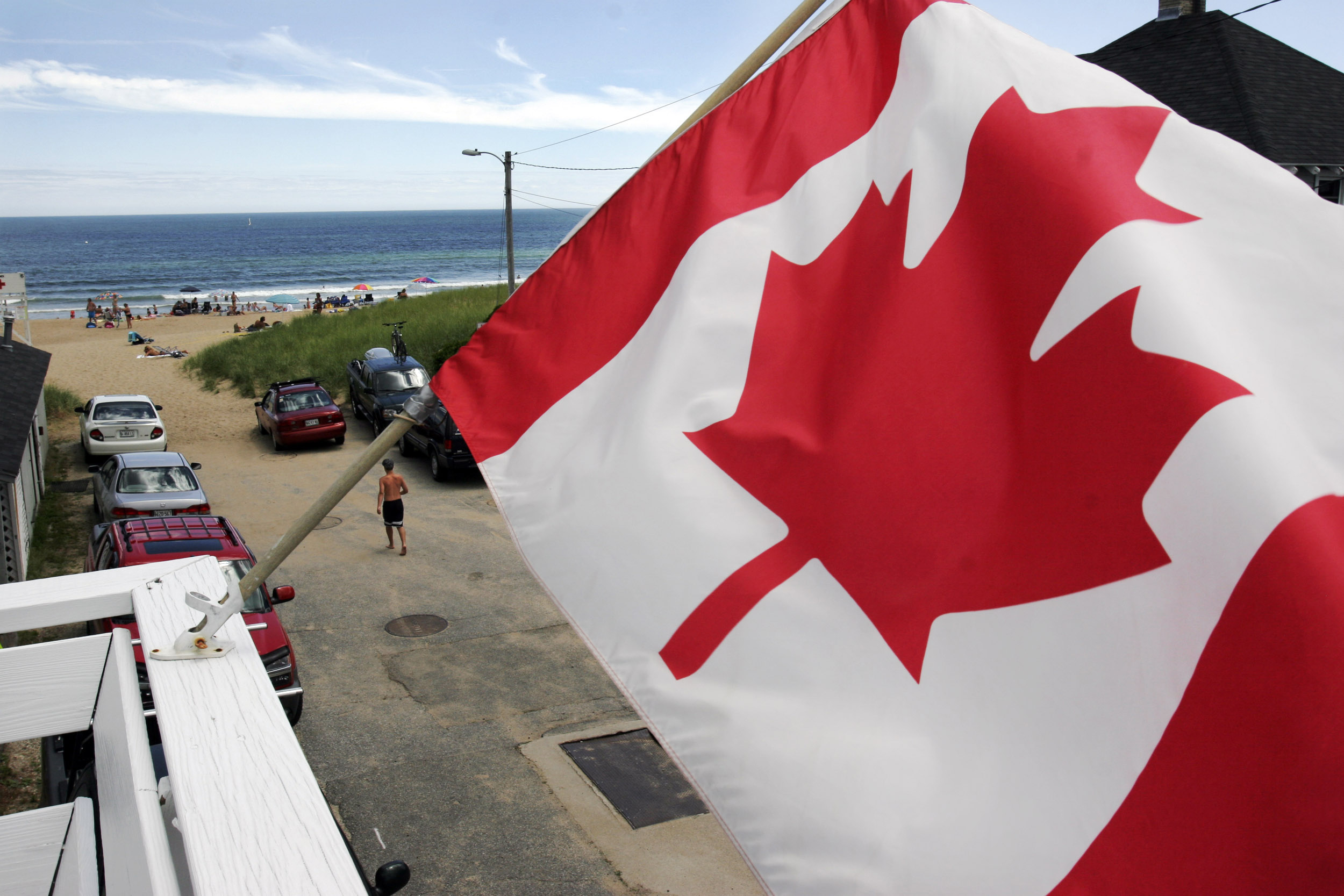 Canadians are canceling or postponing their Maine vacation plans because of long waits to get or renew passports.