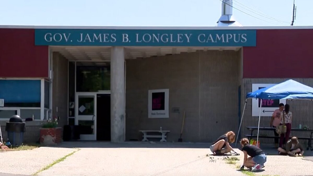 Former students and staff come together to clean vandalized Lewiston school