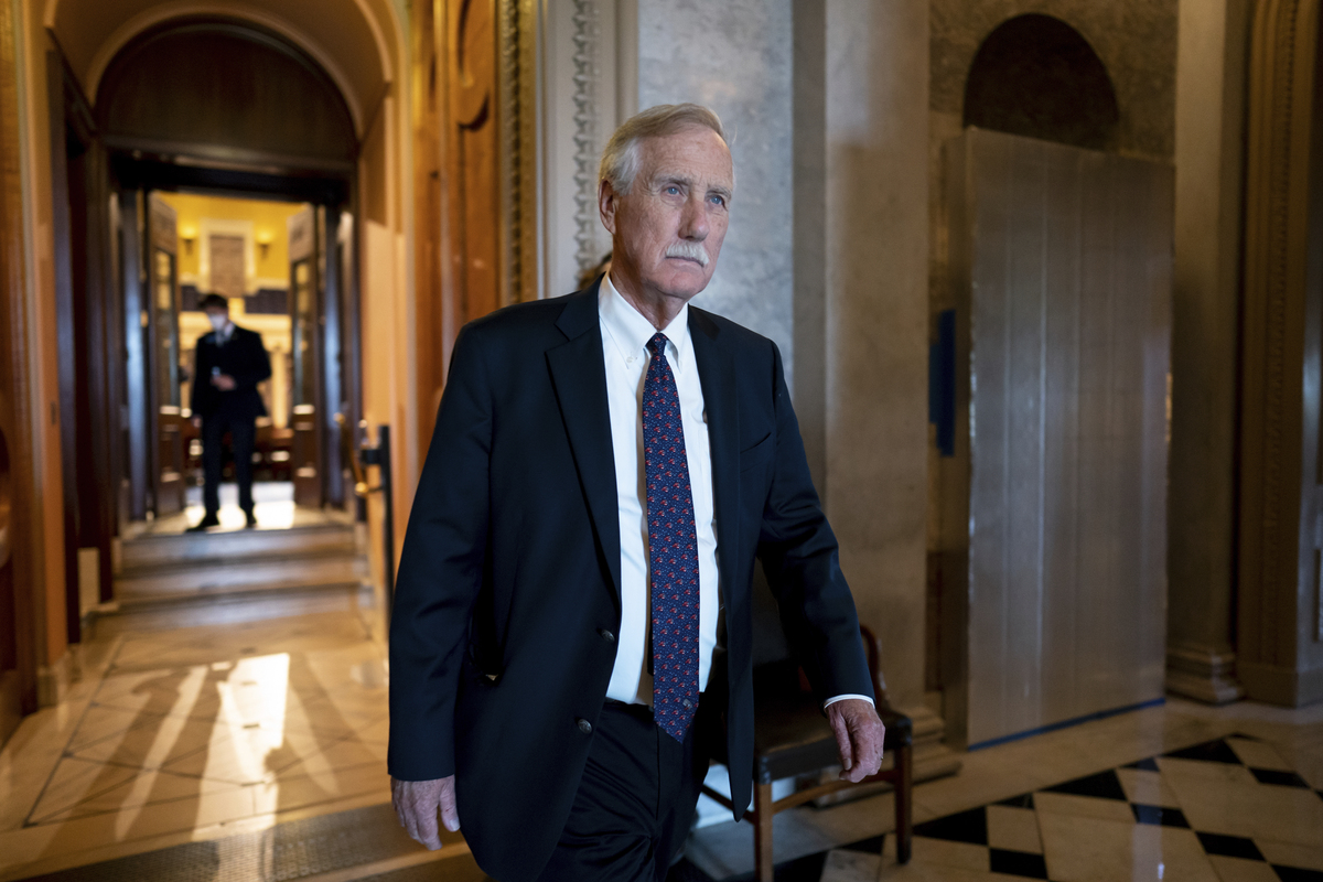 U.S. Sen. Angus King walks down a hallway.