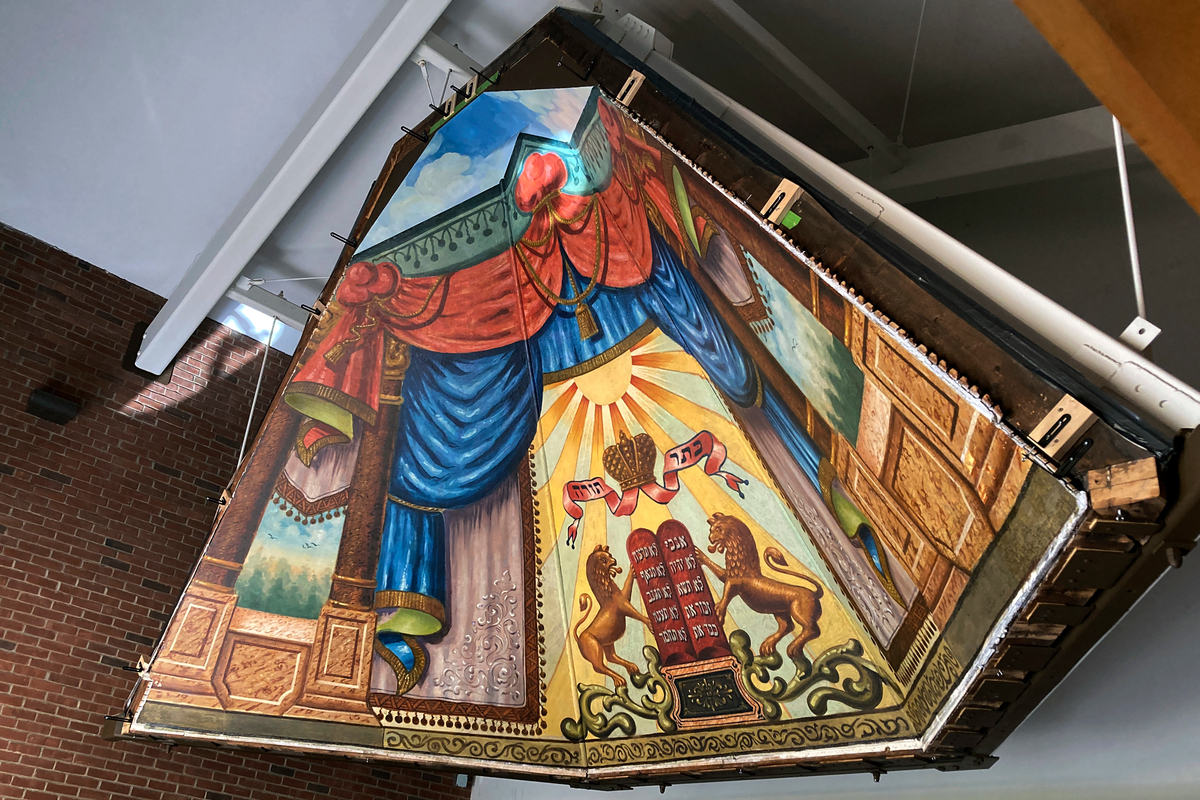 A long-hidden mural has been rehabbed and moved to a new home.