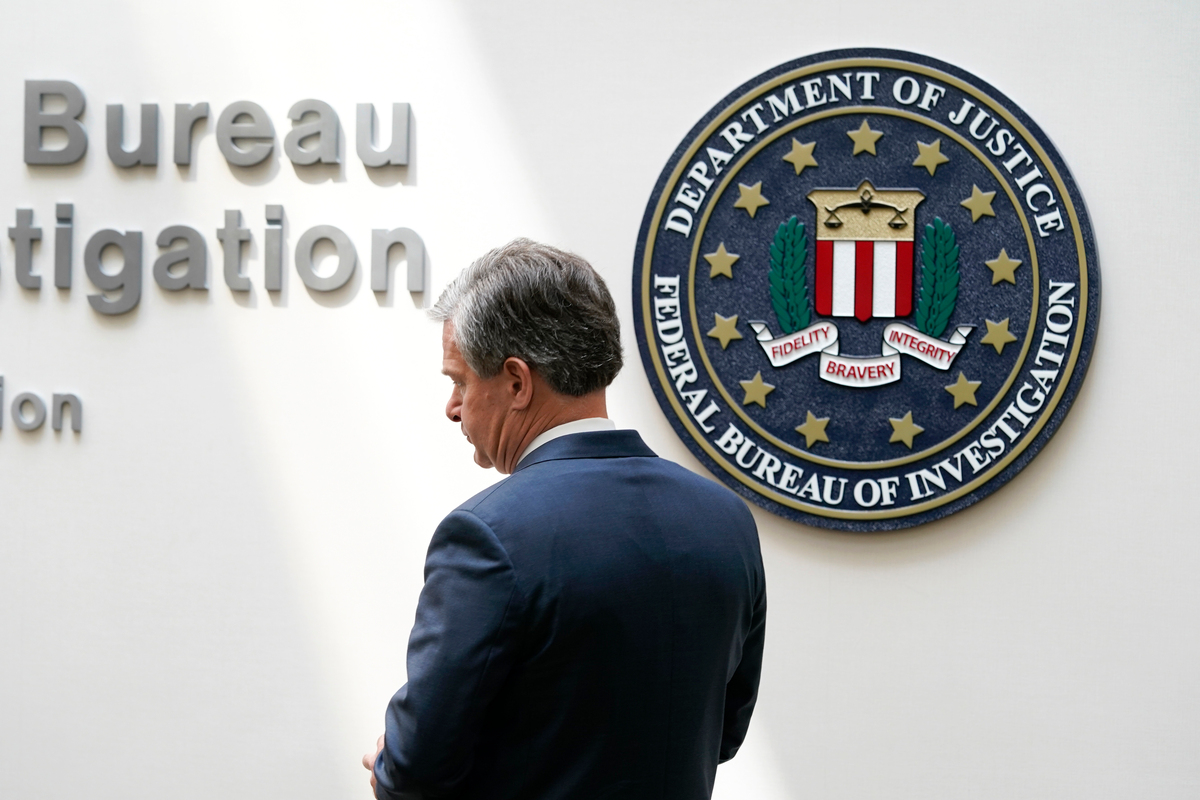 An armed man exchanged gunfire with police after fleeing an FBI office.