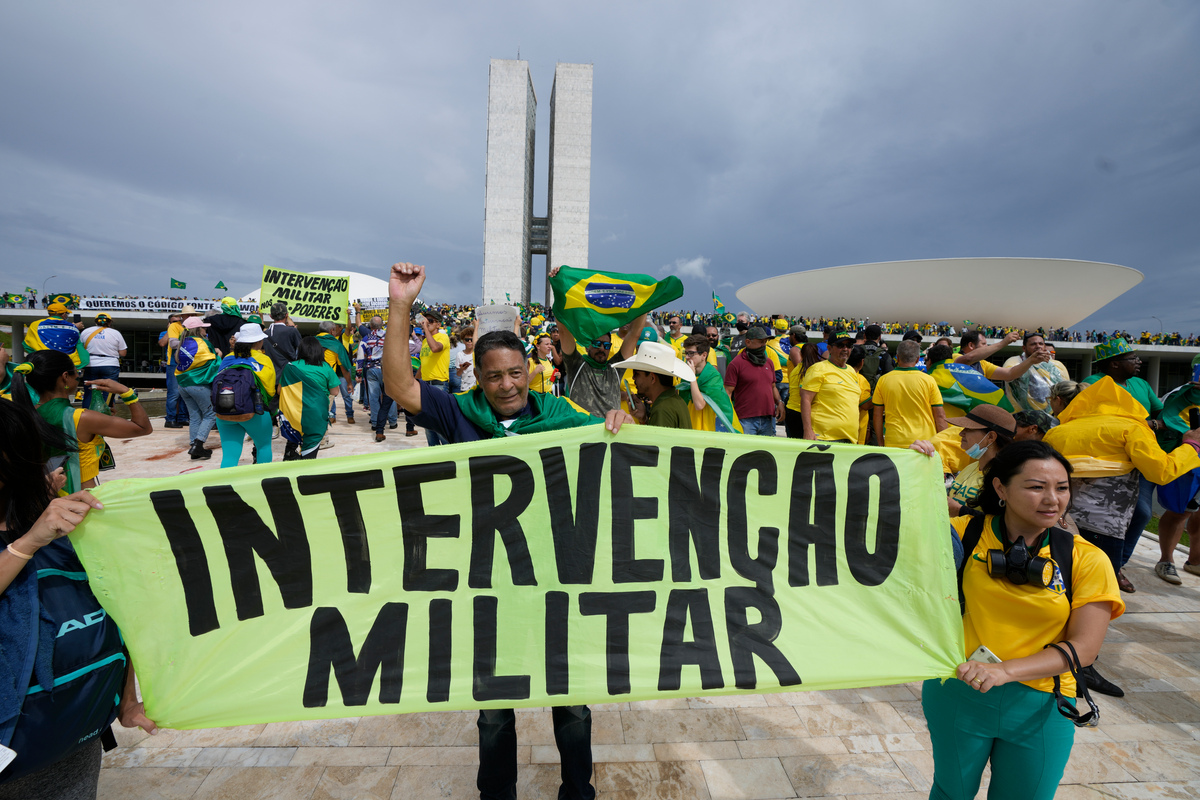 Jair Bolsonaro supporters call on the military to intervene and illegally place the ousted politician in the presidency on Jan. 8 in Brasilia.