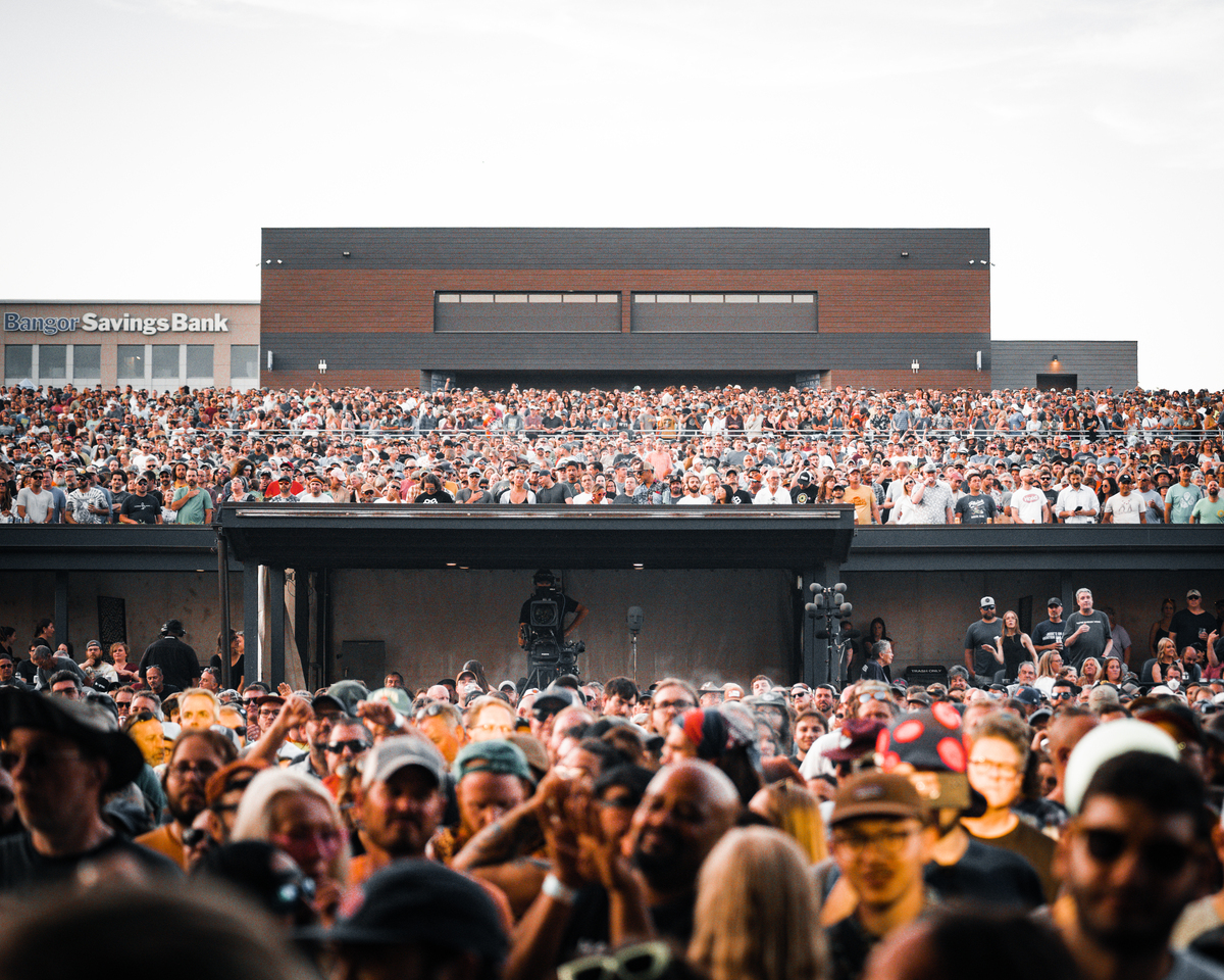 Daniel E. Norton Jr., 43, claims concert staff spun him around, picked him up and threw him “violently to the ground.”