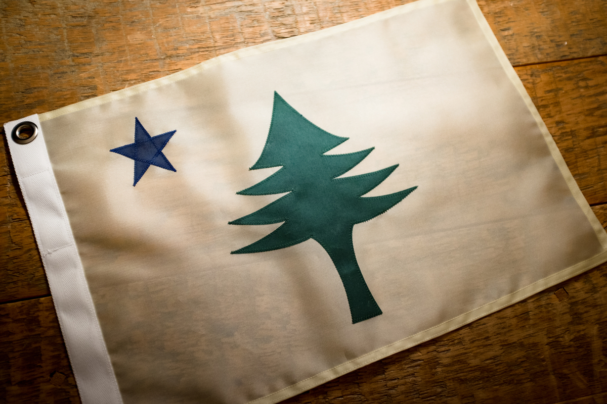 The Maine House voted 64-61 to restore the 1901 flag that features a pine tree and blue star.