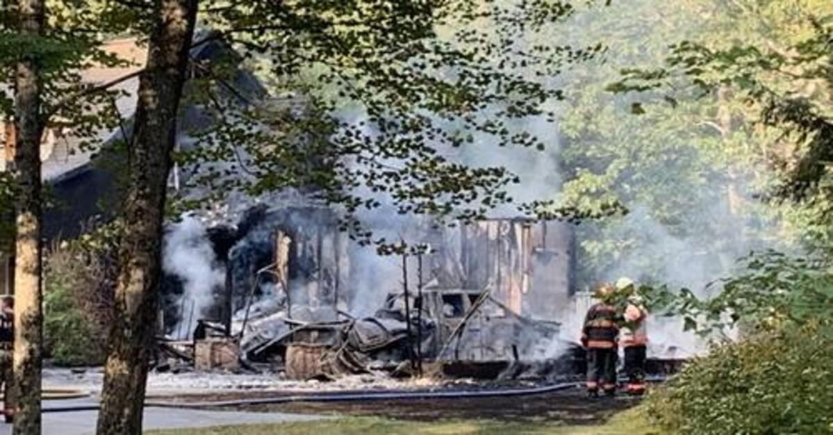 Drivers passing the Gebung Road home called 911 and then alerted the family inside to get out.