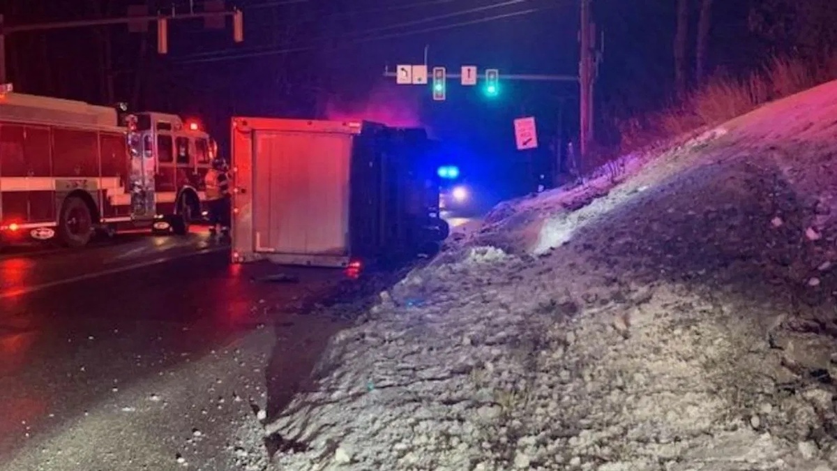 A Dunkin' delivery truck crashed early Sunday morning, leaving the driver trapped inside.